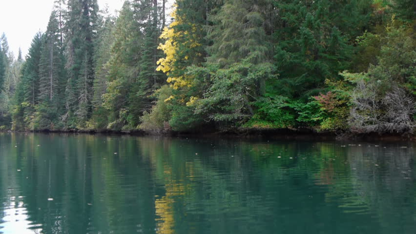 A kayaker paddles across the screen at Lost Creek reservoir in northern California