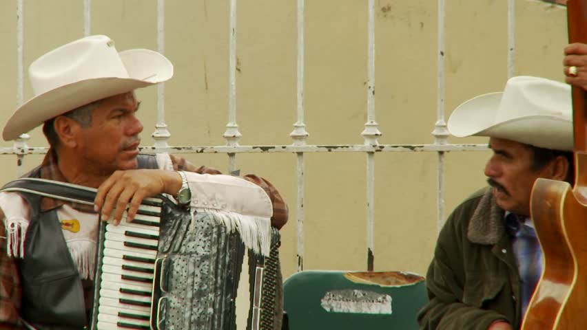 TIJUANA, MEXICO - CIRCA 2008: Musicians chat in downtown Tijuana Mexico.