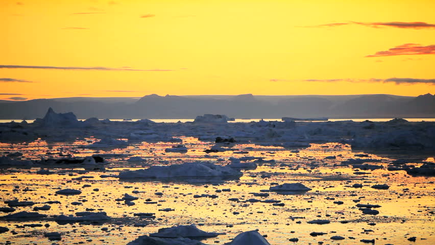 Pan of Golden Sunset over Melting Ice Floes
