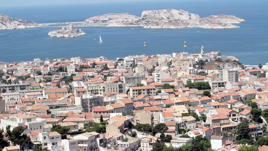 Marseille France city, coast, islands and sailboats from above at Basilica Notre Dame de la Garde. Downtown, marina and fort along coast of Mediterranean Sea.