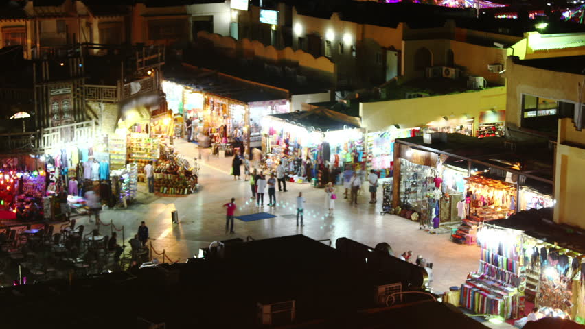 Time lapse of crowds of people on a shopping center in Sharm-el-Sheik, Egypt at night.