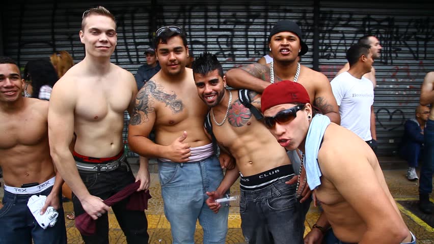 SAN PAULO, BRAZIL - CIRCA JUNE 2011: Shirtless men pose at the LGBT Gay Pride Parade on Avenida Paulista circa June 2011 in San Paulo.