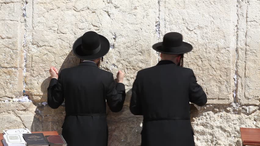 JERUSALEM, ISRAEL - CIRCA OCT 2011: Orthodox Jews pray at the Western Wall circa October 2011 in Jerusalem.