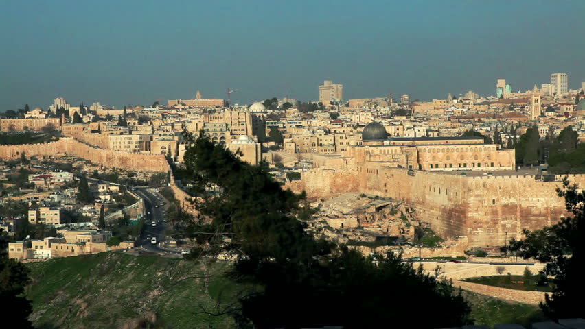 the walled old city of Jerusalem, Israel, showing the south steps ruin, the Temple Mount with the Al-Aqsa Mosque and the Dome Of The Rock, the Bab Al-Rahman Muslim cemetery