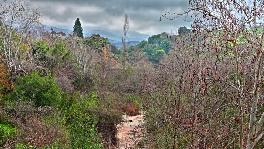 Wide shot of a winding river from the mountains of the Golan Heights in Israel.  