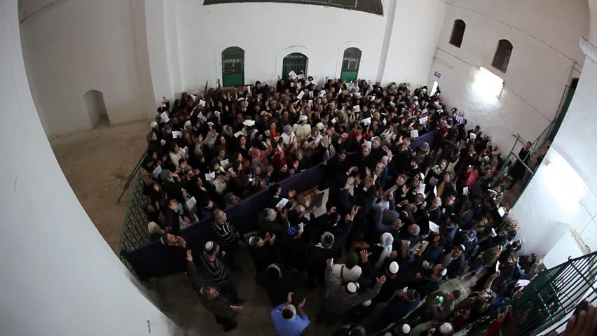 KIRYAT ATTA, ISRAEL - DEC 9, 2009: Rabbi Mamo Shalita encourages others to dance and chant with him at the Tomb of the Prophet of Samuel on December 9, 2009 in Kiryat Atta.