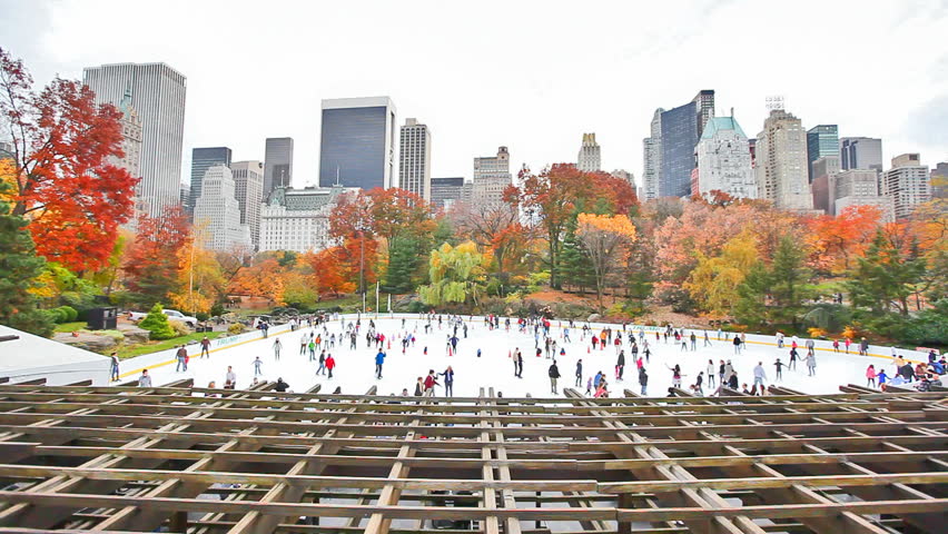 Ice skaters having fun in New York Central Park in fall