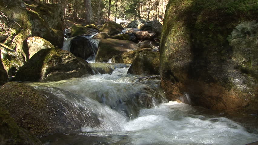 Stream spills down rocky slope