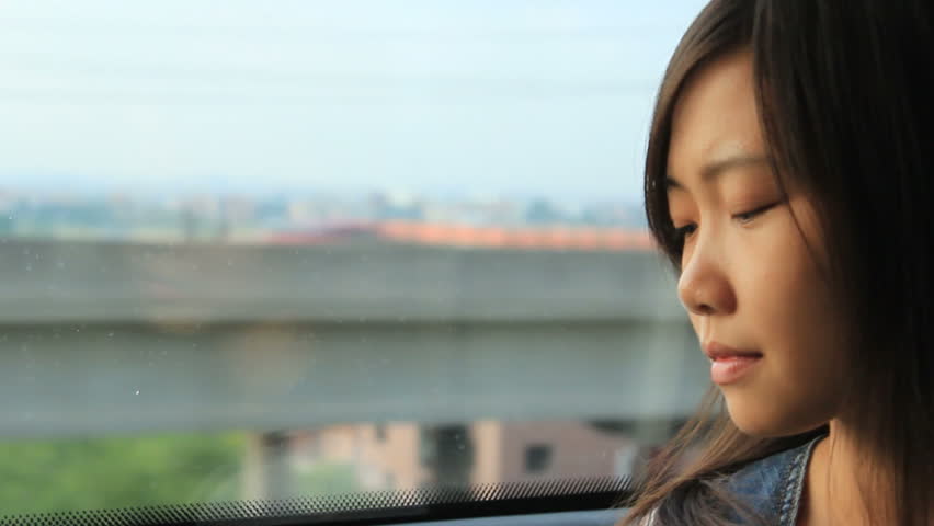 asian girl in a train.