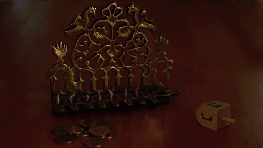 Chanukah - Hand lighting a Menorah
