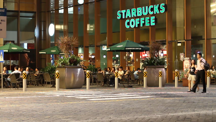 SINGAPORE - NOV 26: Outdoor area of a Starbucks store at night on November 26, 2009 in Singapore. Starbucks coffee bars in Singapore marked the chain's first expansion into South Asia (1996). 