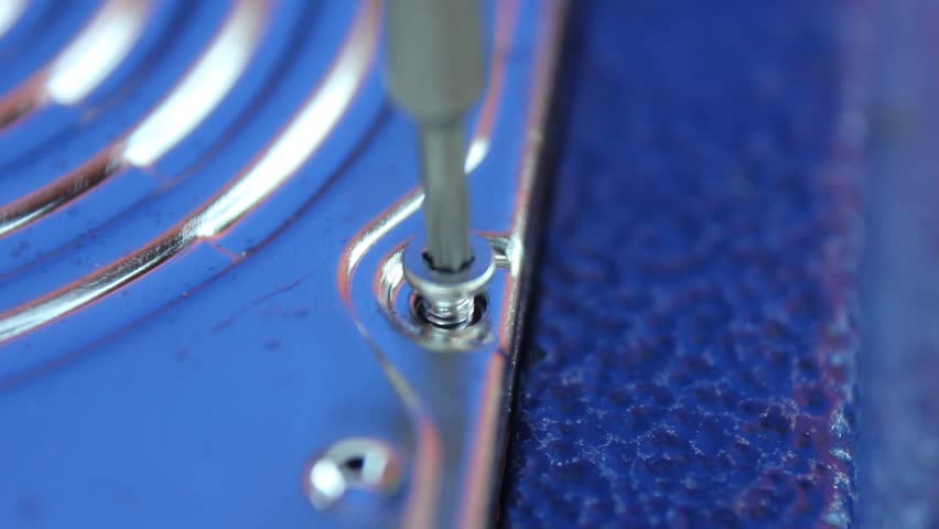 Macro Of HDD Cover Screw Being Turned