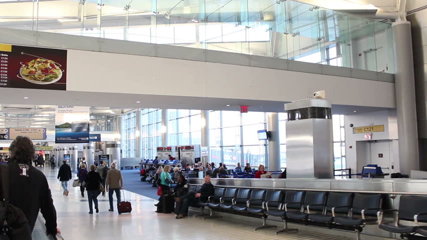 NEWARK, NJ - DEC 4: Travelers await their flights at EWR airport in Newark, NJ on December 4, 2011. The airport handles over 30 million passengers annually.