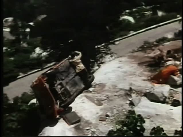Car falling off cliff and blowing up