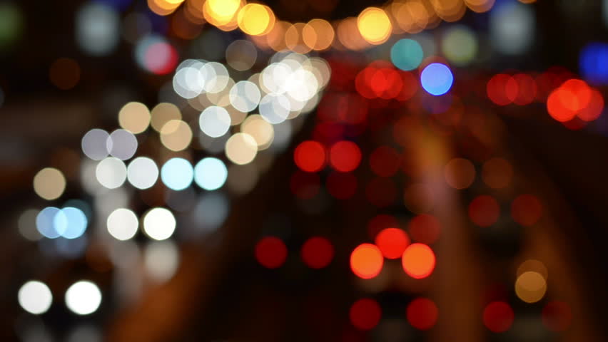 Abstract blurred colorful circles (defocused night freeway scene), suitable as a background