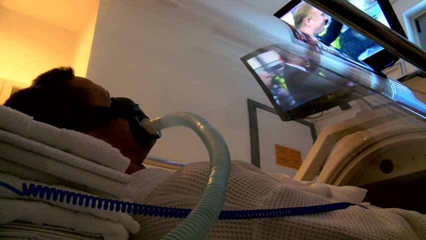 MONTENEGRO - PODGORICA 2011: Sportsman receiving treatment in hyperbaric chamber c. 2011 in Montenegro. Hyperbaric oxygen therapy allows patients to breathe 100% pure oxygen under increased pressure.