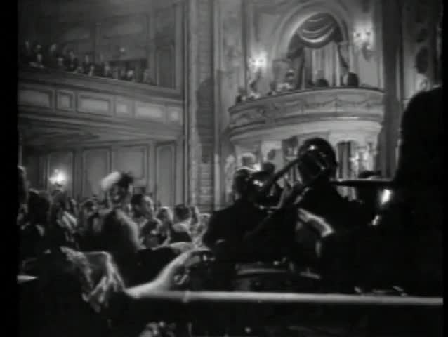 Audience in theater applauding