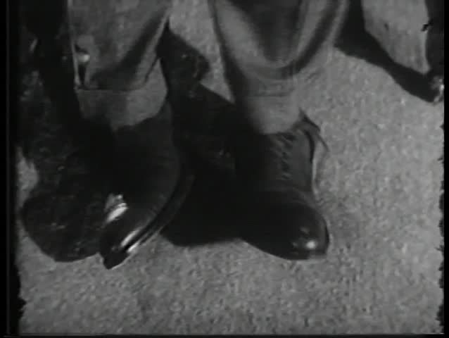 Close-up of feet moving in tight shoes
