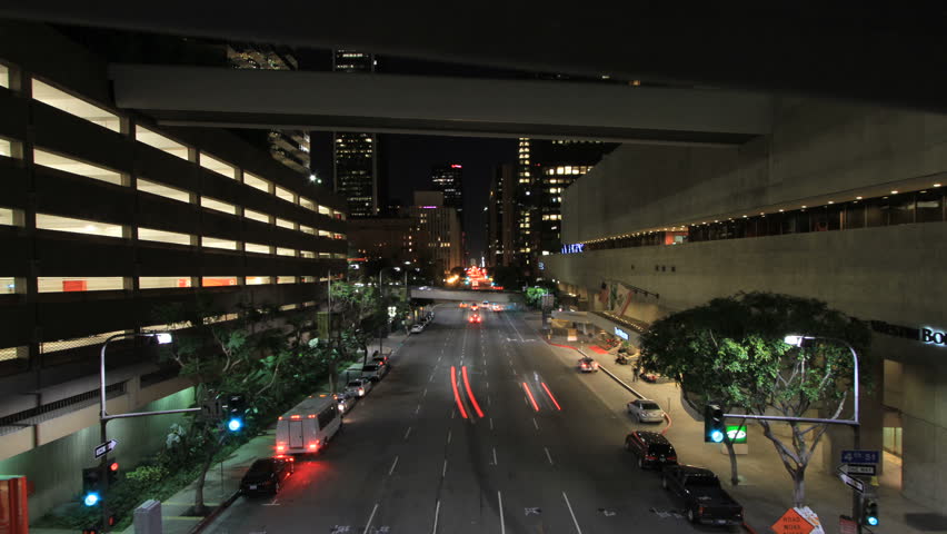Motion Timelapse overlooking Flower Street behind bridge railing in Los Angeles