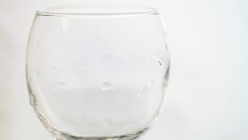pouring water into glass