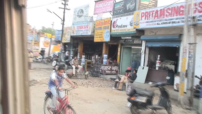 JALANDHAR, INDIA - AUGUST 20, 2006: Bus driver wearing a Yankees baseball cap