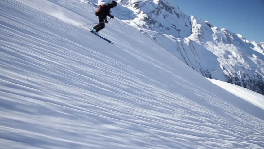 Woman is skiing downhill