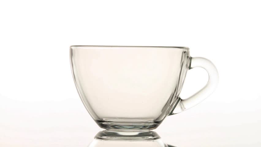 Brewing up hot tea with teabag isolated on white background