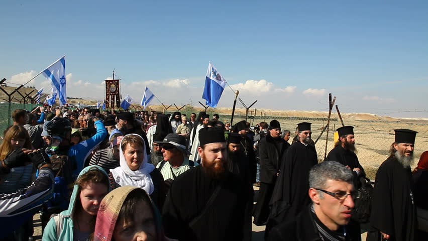 QASR AL YAHUD, ISRAEL - JANUARY 18: Greek Orthodox Patriarch's procession with priests and pilgrims at march in Qasr Al Yahud Baptismal Site, Israel on January 18, 2012.