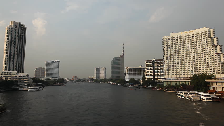 BANGKOK, THAILAND - JANUARY 20, 2011 Time Lapse of Chao Phraya River in Bangkok, Thailand, View from Taksin Bridge, Boats