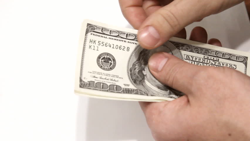Counting hundred dollar bills