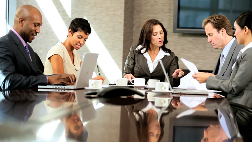 Female caucasian business executive in meeting with her multi ethnic team