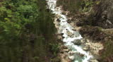 HD: Flying over raging river - aerial view
