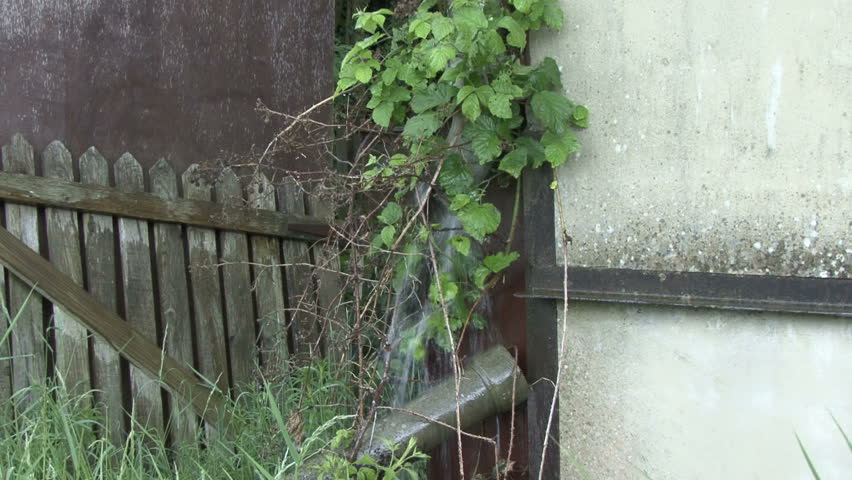 Rainwater leaking from broken drainpipe 3. HD.