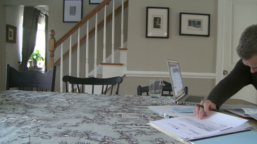 Man working on bills and finances
