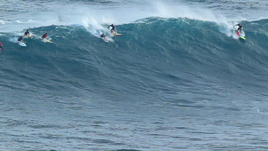 MAUI, HI - January 31: Professional surfers ride a giant wave at the legendary big wave surf break known as "Jaws" during one the largest swells of the winter January 31, 2012 in Maui, HI.