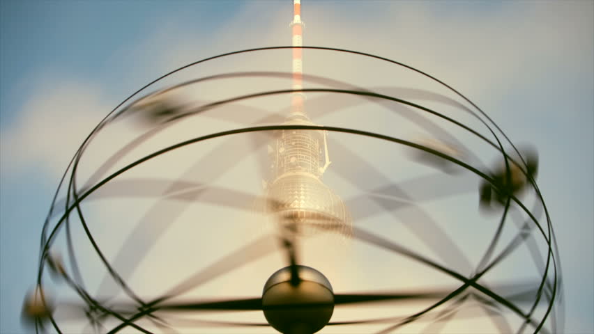 BERLIN, GERMANY, CIRCA 2011: (Time lapse view) The World Time Clock (Weltzeituhr) & TV Tower (Fernsehturm) at Alexanderplatz in Berlin, Germany circa 2011.