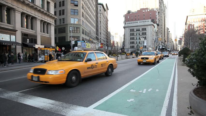 NEW YORK - CIRCA JANUARY 2012: Yellowcabs driving near the Flatiron Building, Fifth avenue and Broadway avenue, circa January 2012 in New York City.  