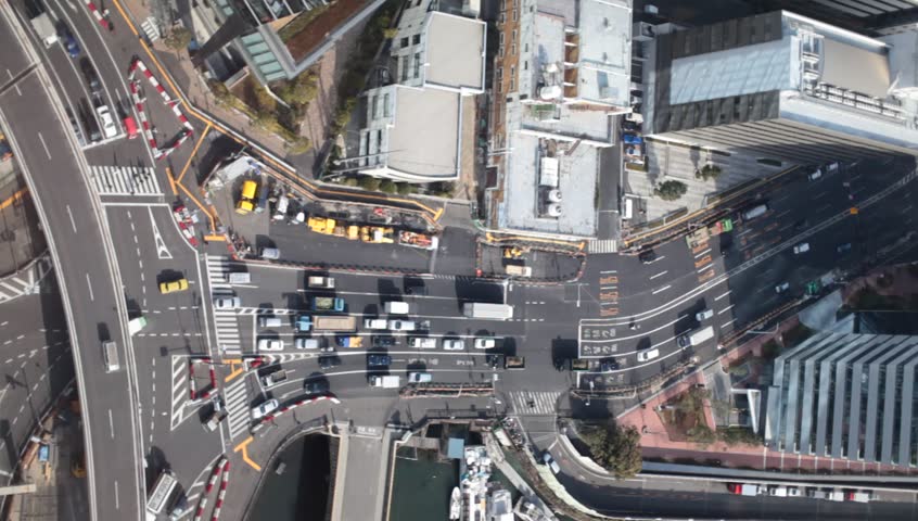 Aerial view of a busy crossing in Central Tokyo, Japan during midday.