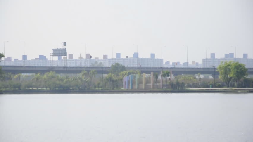 Expressway bridge on the reservoir of urban park.