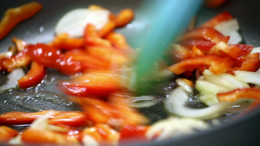 Vegetables are fried in a pan 