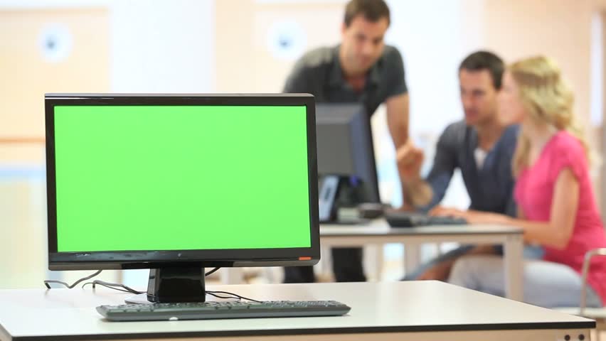 Green desktop screen set in front of workgroup