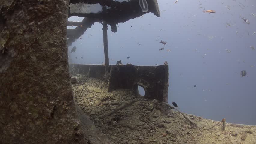 Scuba divers POV diving swimming along the Port side gang way the wartime shipwreck the SS Thistlegorm. Red Sea, Egypt.