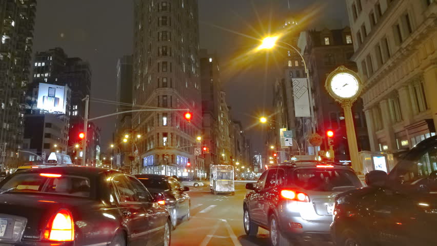NEW YORK CITY - Feb 10: Timelapse of the Crossing at Flatiron Building at nighttime on February 10, 2012 in New York City, USA. 
