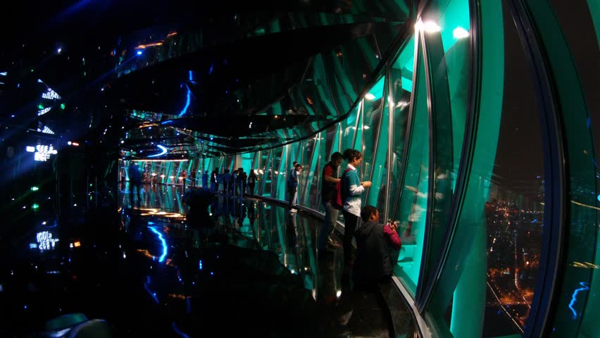 GUANGZHOU - NOV 24: (Timelapse View) Visitors walk and take photographs inside Canton television tower on November 24, 2011 in Guangzhou, Guangdong, China.