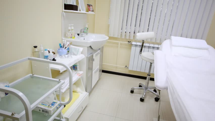 In cosmetology room of beauty parlour cosmetic armchair stands in middle