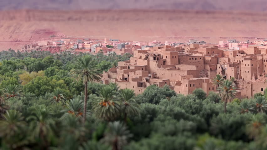 Panorama of a village in Moroccan hills, Morocco, thousand Kasbah road. Oasis in Sahara desert area. Tilt-shift effect.