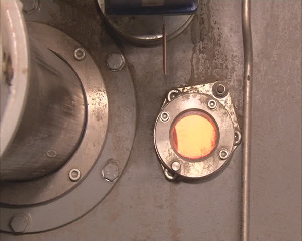 Boiler and small window in it for process monitoring. Heating technologies in winter.
