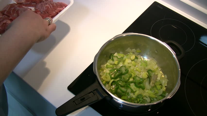 Woman preparing a stew for lunch