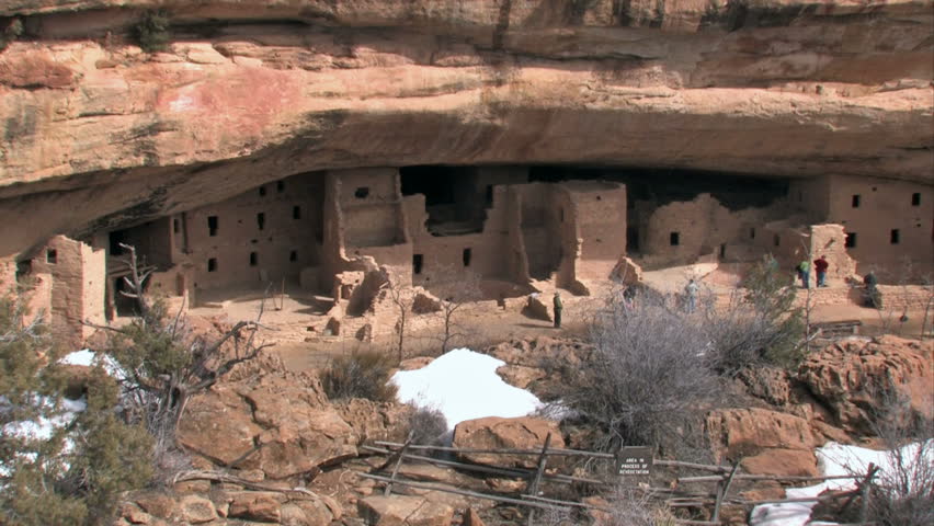 Mesa Verde National park in southern Colorado. Closer of Spruce Tree ruins, tourists and ranger. Ancient Pueblo cliff dwellings and rock buildings. 