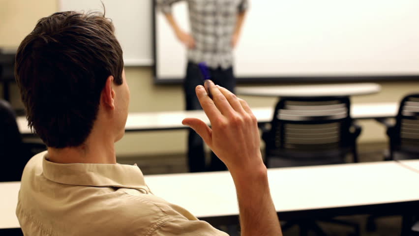Bored student flicking pen while someone talks